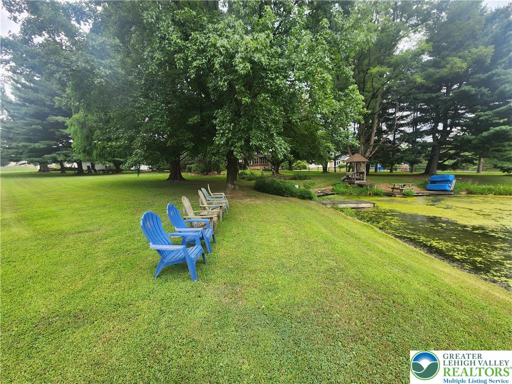 861 Municipal Road Walnutport, PA 18088 - Photo 81 of 94 a view of a swimming pool with a garden