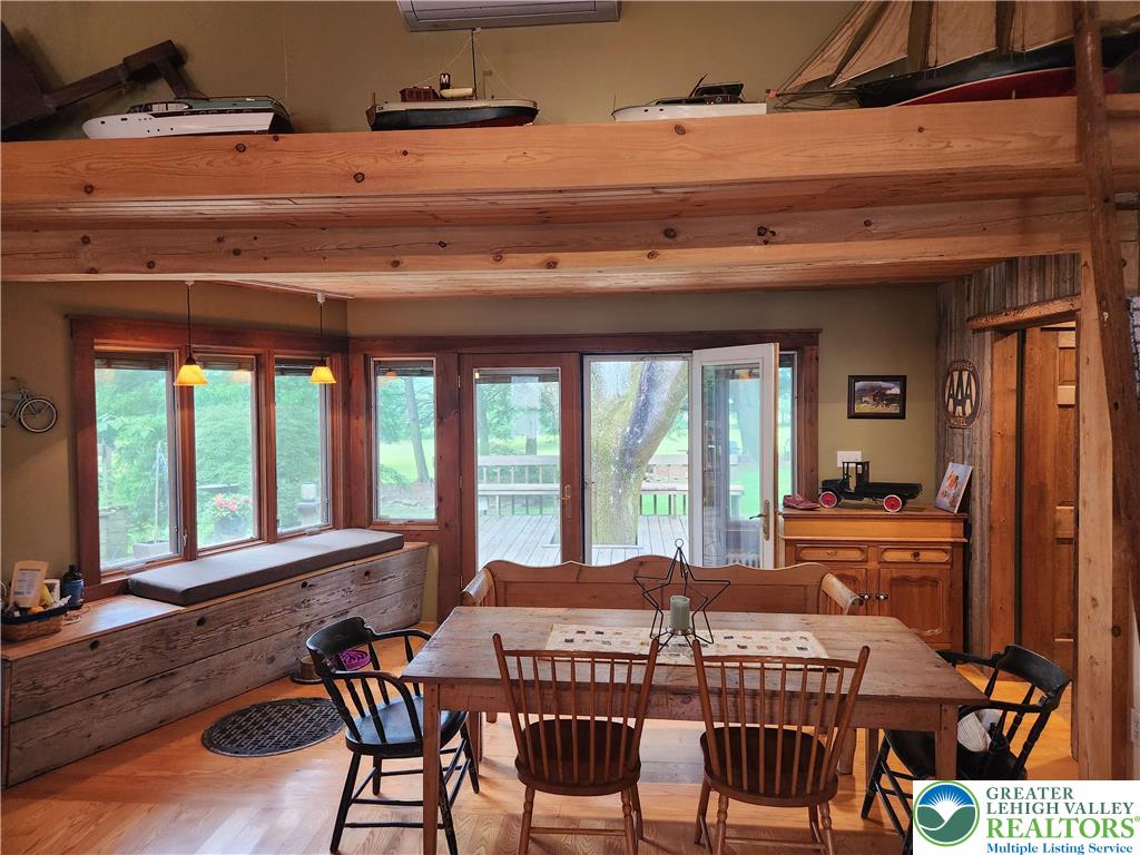 861 Municipal Road Walnutport, PA 18088 - Photo 9 of 94 a view of a dining room with furniture large windows and wooden floor