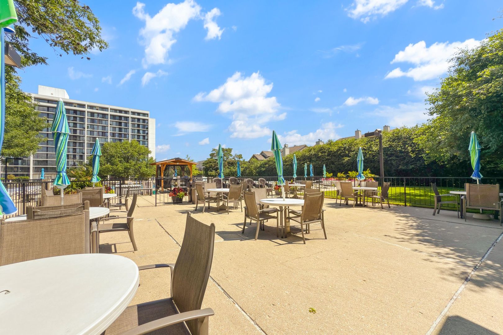 2005 South Finley Road, Unit 1204 Lombard, IL 60148 - Photo 30 of 35 a view of a swimming pool with outdoor seating