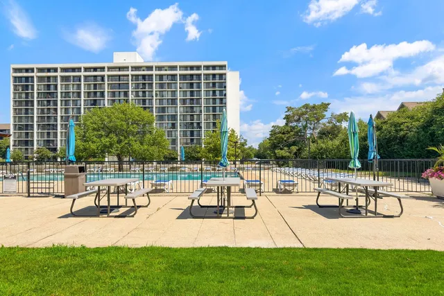 a view of a patio with a table and chairs