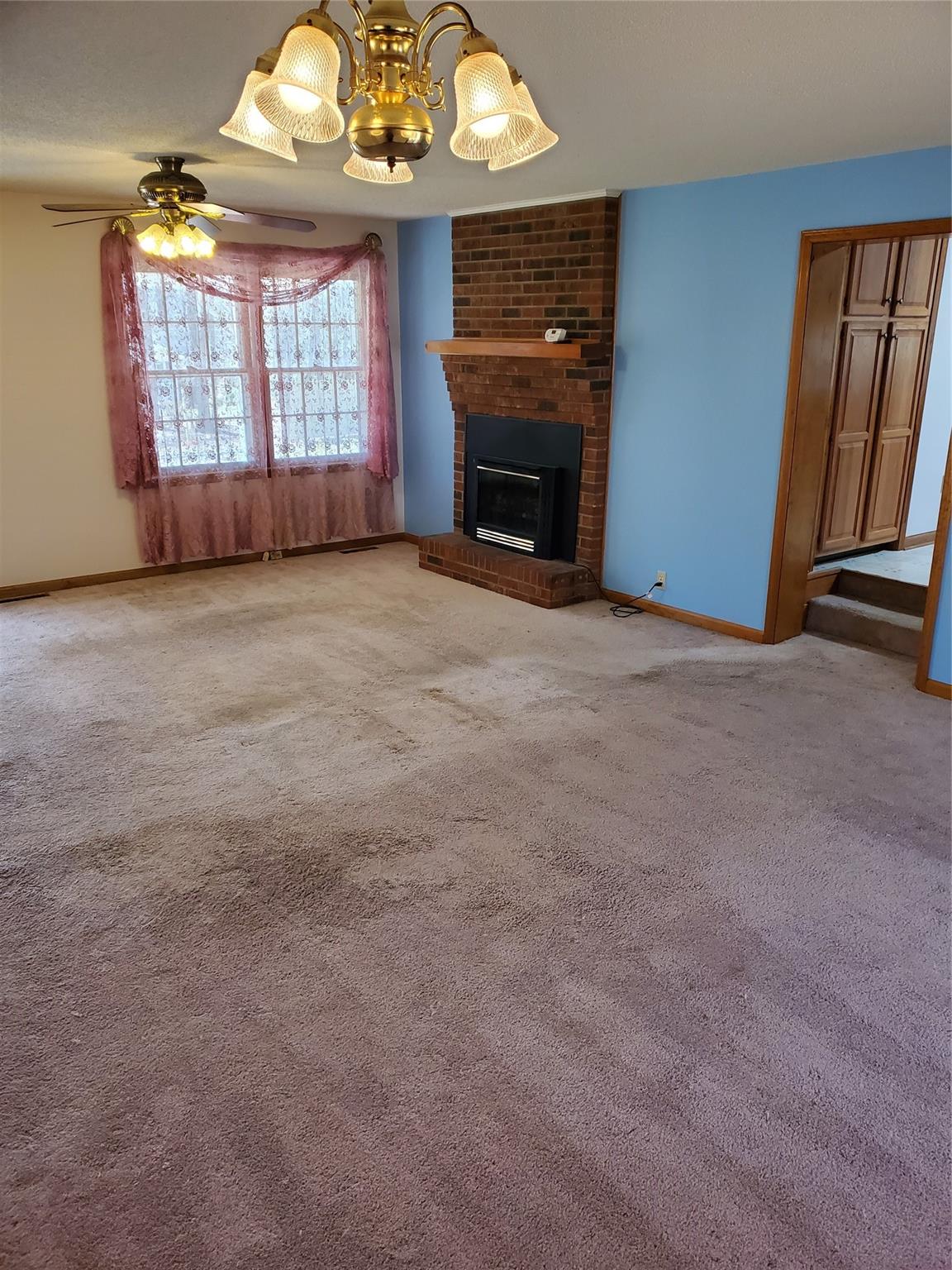 73 Lofty Pine Lane Mills River, NC 28759 - Photo 12 of 29 an empty room with a fireplace and windows