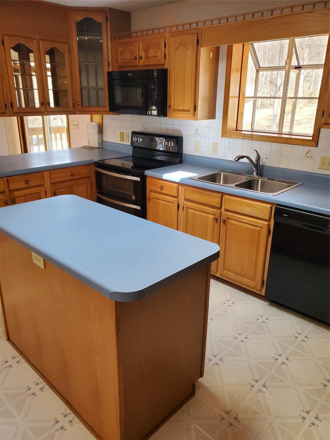 73 Lofty Pine Lane Mills River, NC 28759 - Photo 14 of 29 a kitchen with stainless steel appliances a sink a stove a microwave a counter top space and cabinets