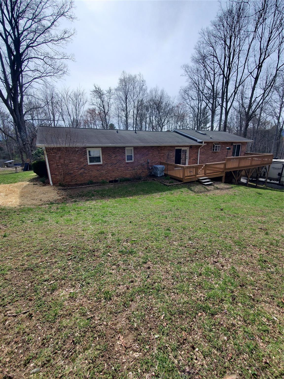73 Lofty Pine Lane Mills River, NC 28759 - Photo 2 of 29 a view of a house with backyard and sitting area