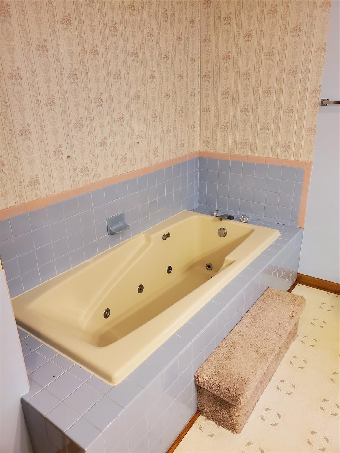 73 Lofty Pine Lane Mills River, NC 28759 - Photo 22 of 29 a bath tub sitting in a bathroom