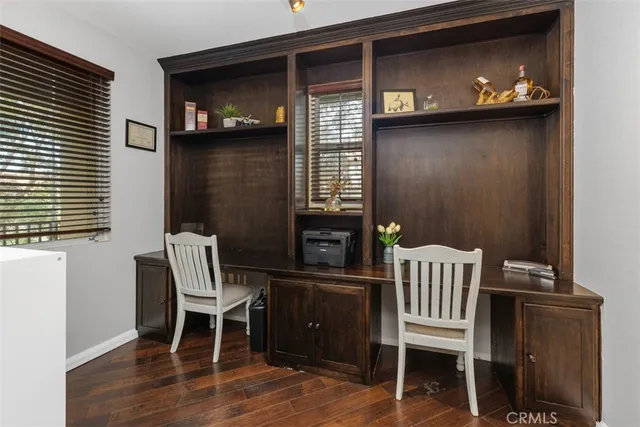 a view of a chairs with a chair and wooden floor