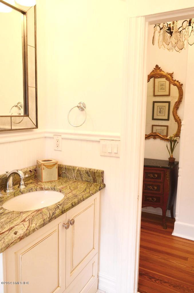 17 Strickland Road Cos Cob, CT 06807 - Photo 11 of 18 a bathroom with a sink and a mirror