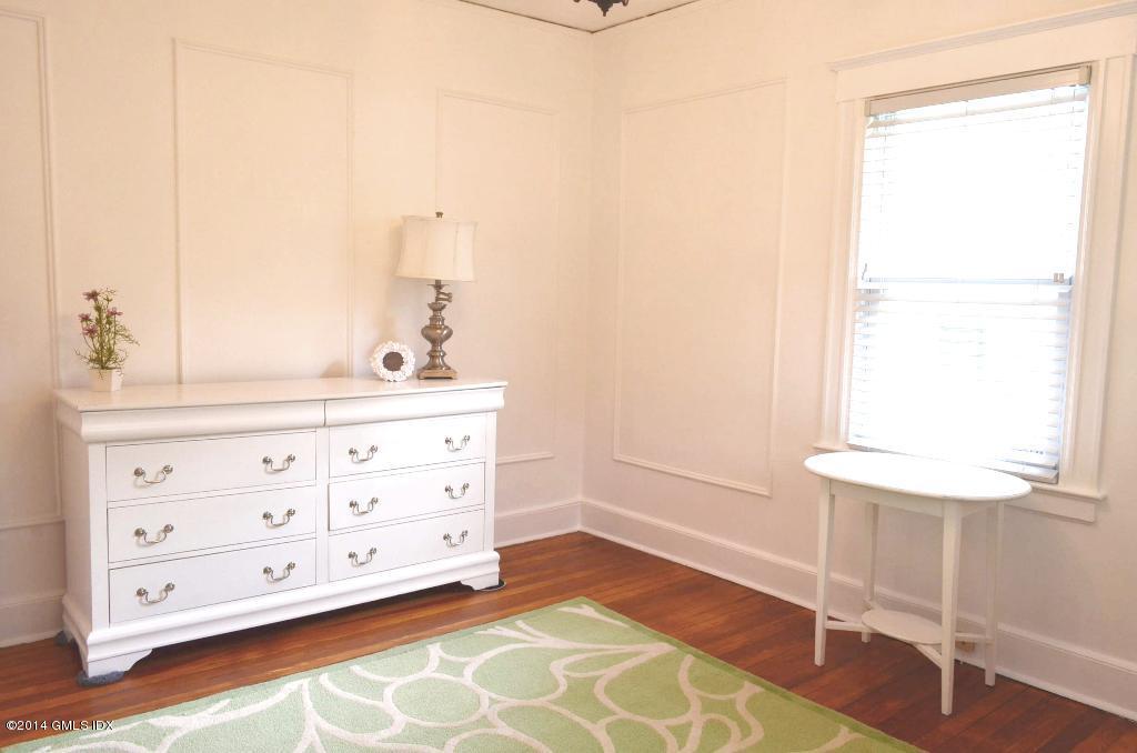 17 Strickland Road Cos Cob, CT 06807 - Photo 12 of 18 a bathroom with a double vanity sink a mirror and a