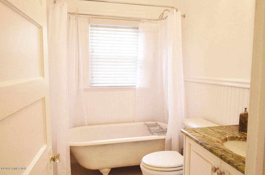17 Strickland Road Cos Cob, CT 06807 - Photo 13 of 18 a bathroom with a sink toilet and shower
