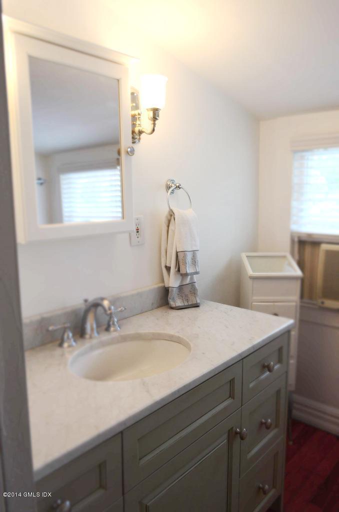 17 Strickland Road Cos Cob, CT 06807 - Photo 16 of 18 a bathroom with a sink and a mirror