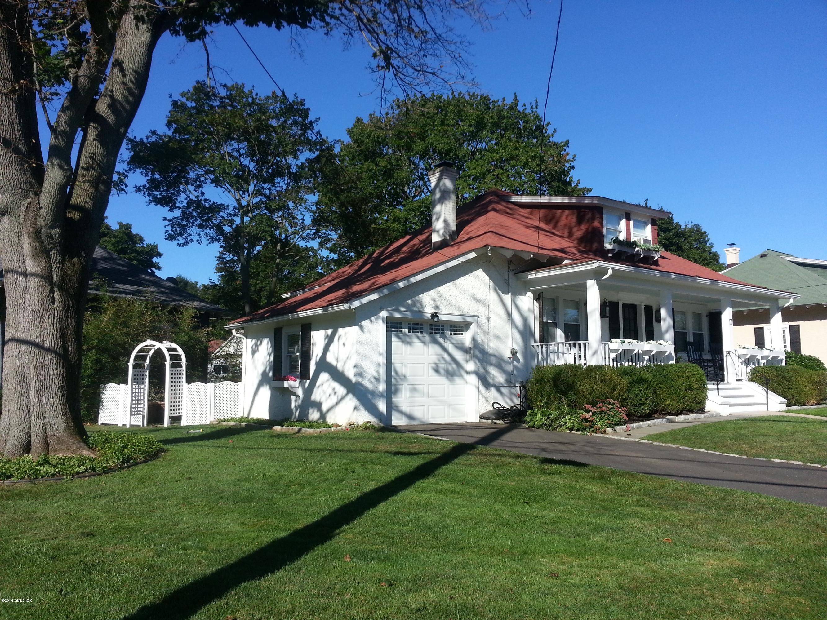 17 Strickland Road Cos Cob, CT 06807 - Photo 2 of 18 a front view of a house with garden