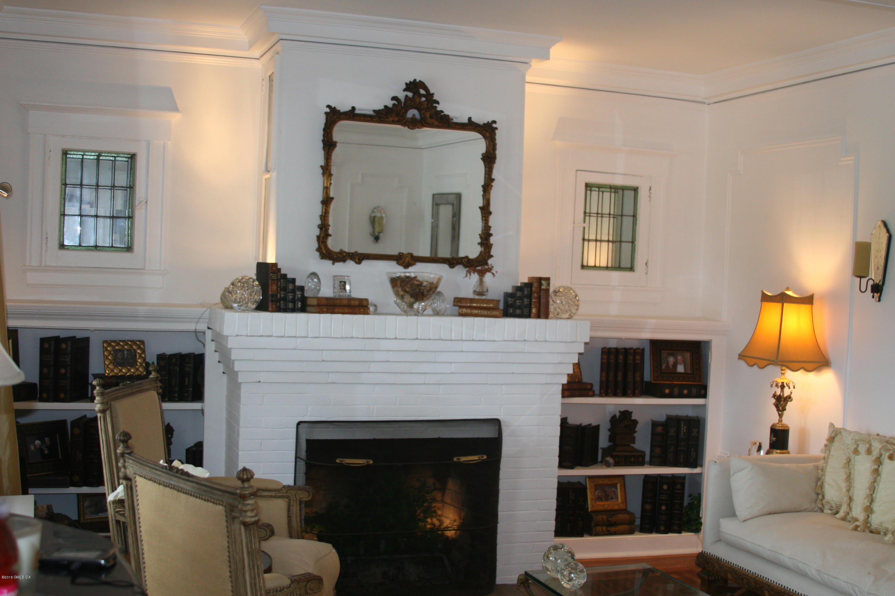 17 Strickland Road Cos Cob, CT 06807 - Photo 6 of 18 a living room with furniture and a fireplace