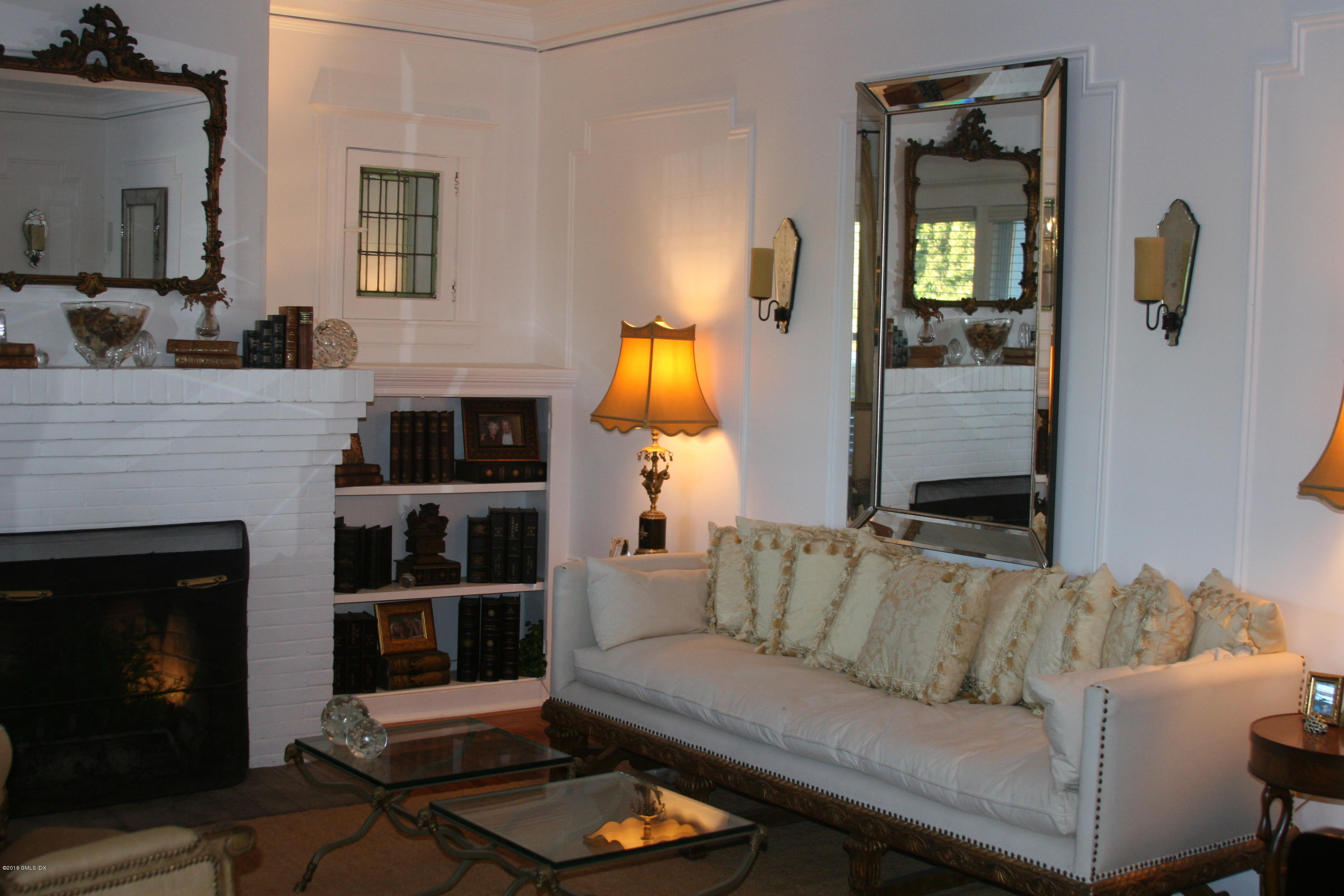 17 Strickland Road Cos Cob, CT 06807 - Photo 7 of 18 a living room with furniture and a fireplace
