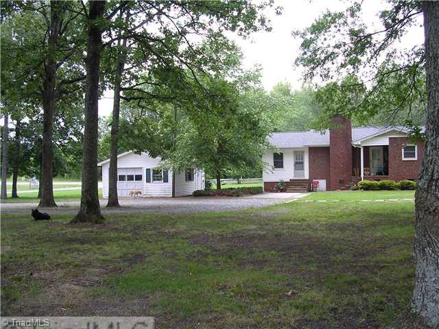 6337 Phillippi Road Julian, NC 27283 - Photo 10 of 16 Exterior Back. Oversized 1c garage, circular drive, parking pad