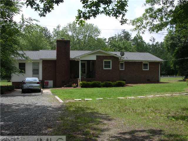 6337 Phillippi Road Julian, NC 27283 - Photo 11 of 16 Exterior Back. Back door entry under covered porch,