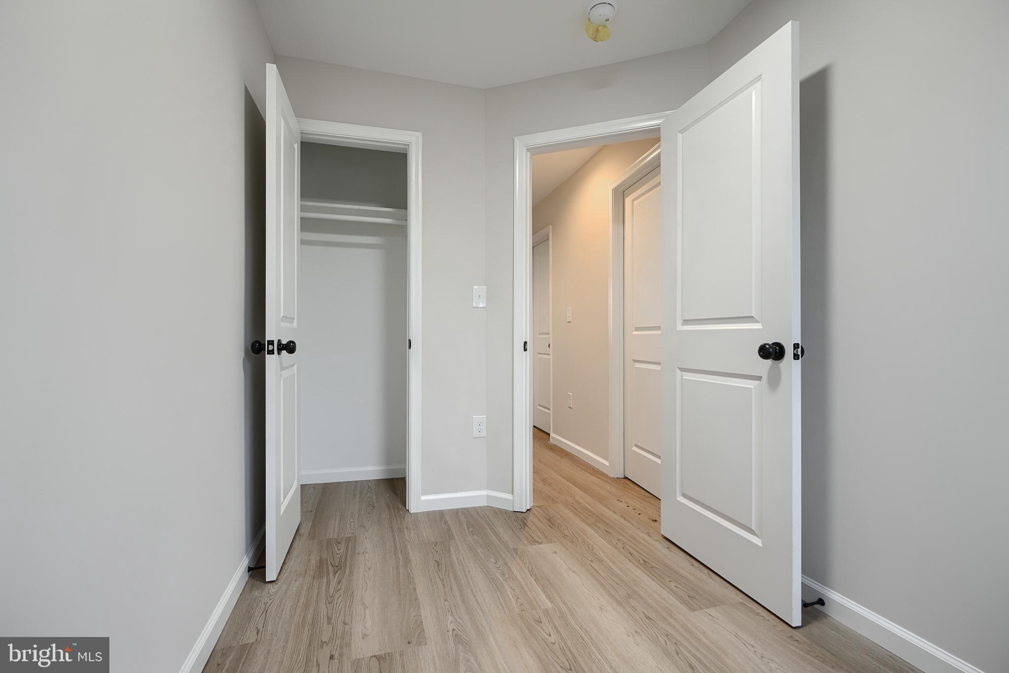 3934 Rokeby Road Baltimore, MD 21229 - Photo 19 of 38 a view of a hallway with wooden floor and closet