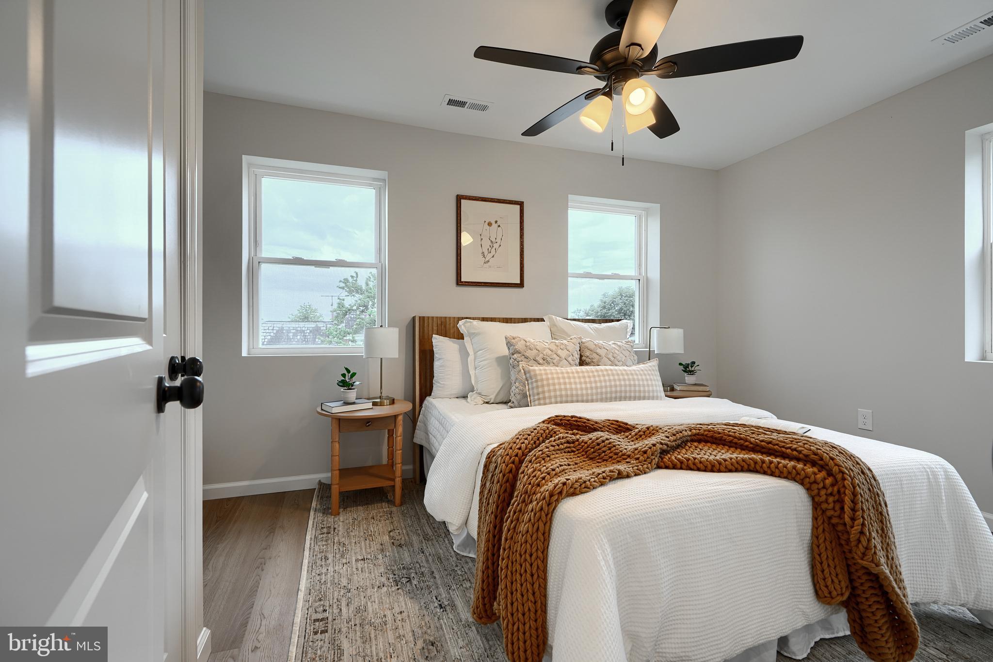 3934 Rokeby Road Baltimore, MD 21229 - Photo 20 of 38 a bedroom with a bed and a chandelier