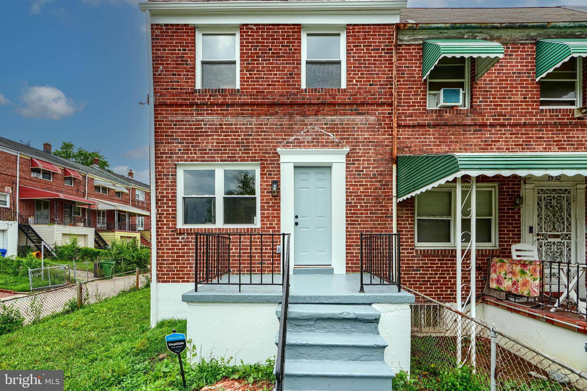 3934 Rokeby Road Baltimore, MD 21229 - Photo 2 of 38 front view of a brick house with a yard