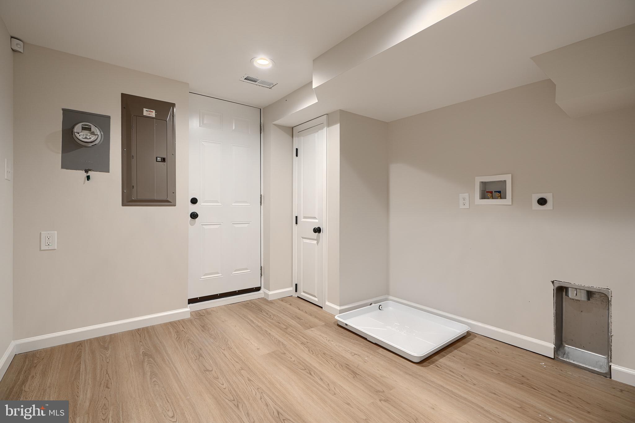 3934 Rokeby Road Baltimore, MD 21229 - Photo 28 of 38 an empty room with wooden floor and windows