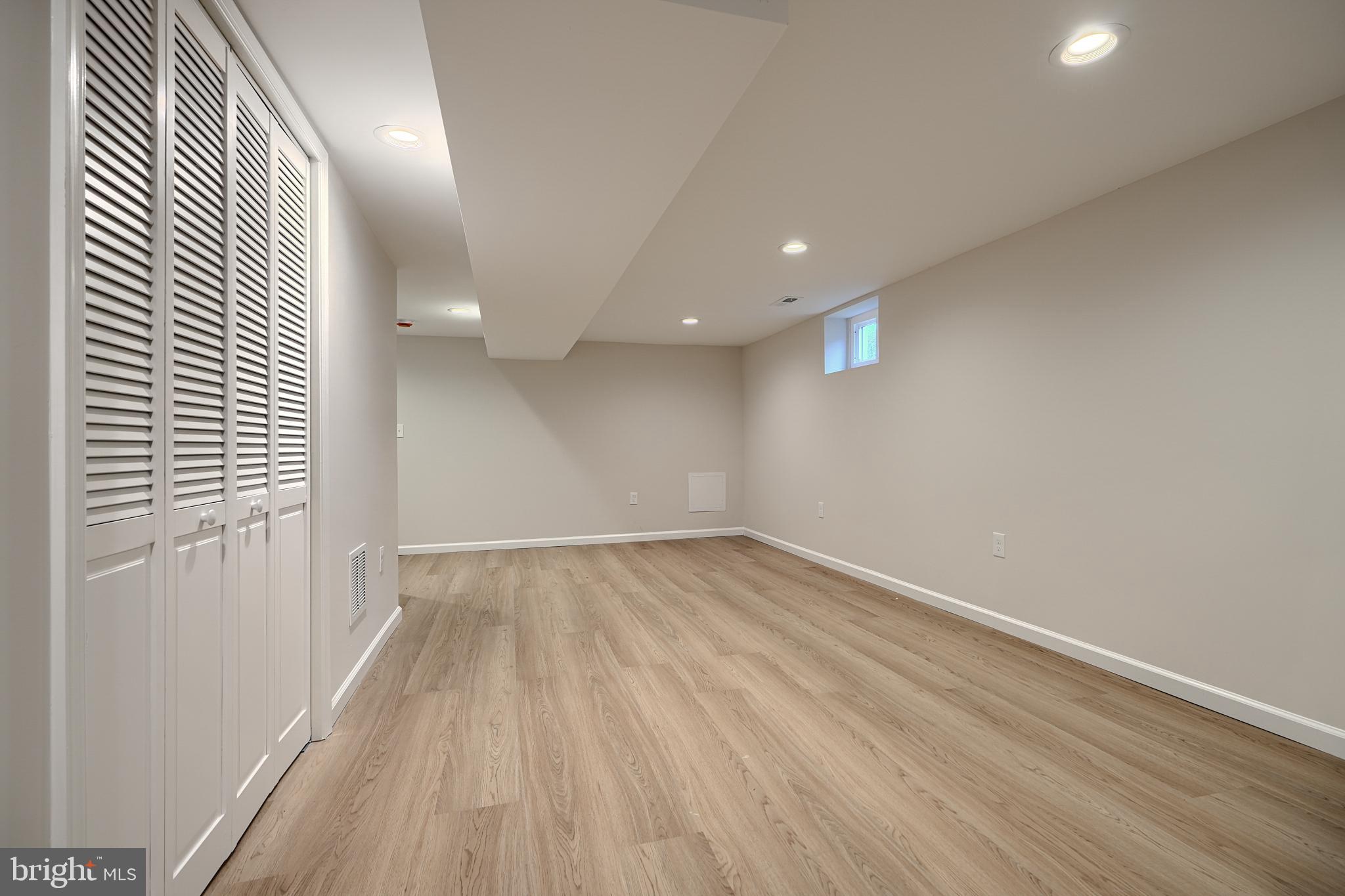 3934 Rokeby Road Baltimore, MD 21229 - Photo 29 of 38 wooden floor in an empty room with a window