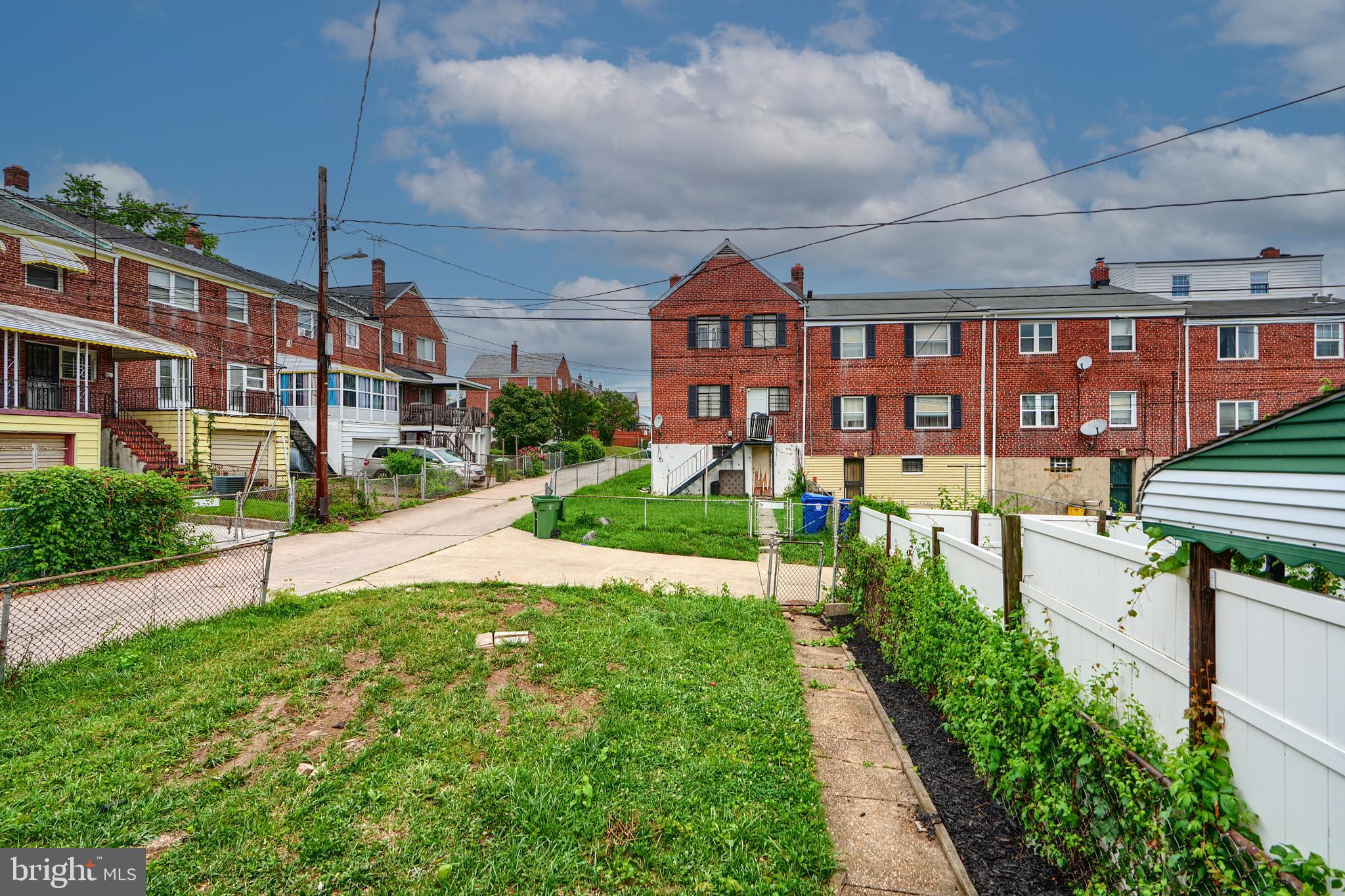 3934 Rokeby Road Baltimore, MD 21229 - Photo 36 of 38 a front view of a building with a yard