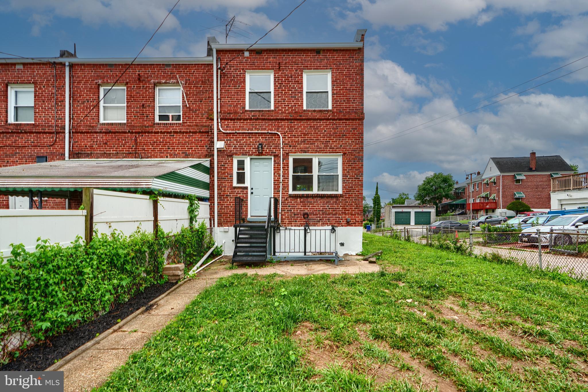 3934 Rokeby Road Baltimore, MD 21229 - Photo 38 of 38 front view of a brick building with a yard