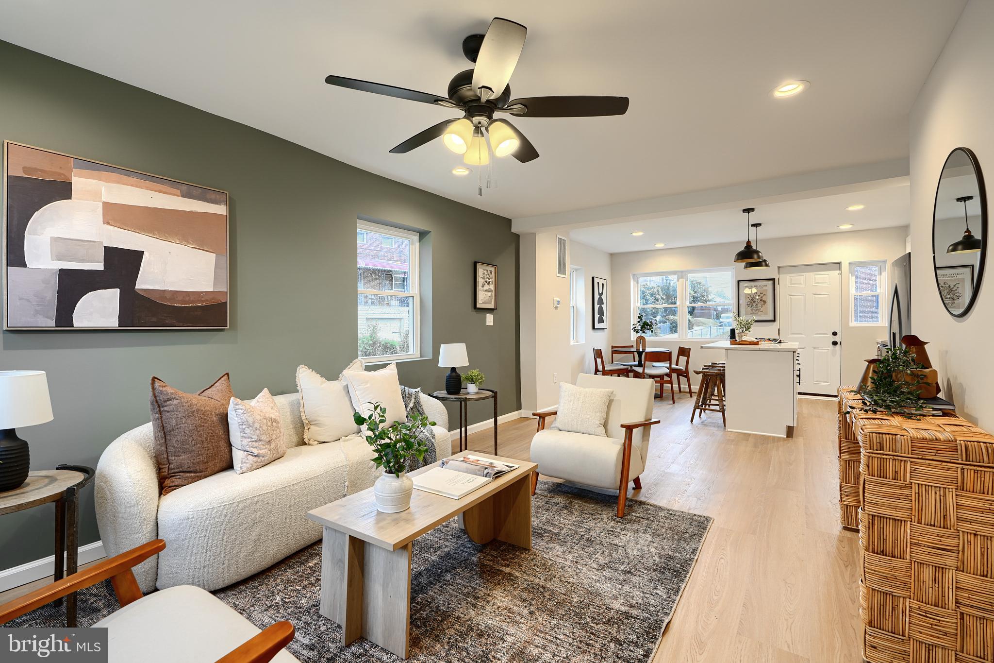 3934 Rokeby Road Baltimore, MD 21229 - Photo 4 of 38 a living room with furniture a chandelier and a rug