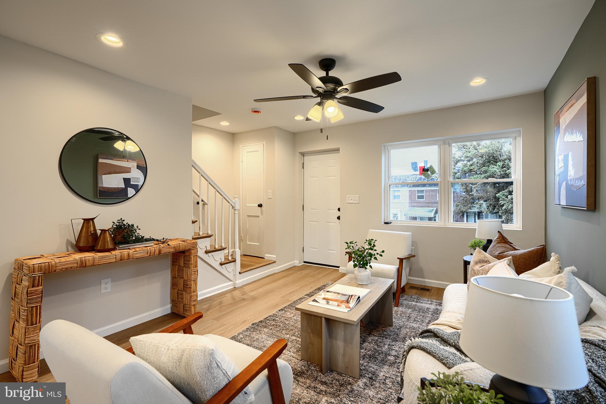 3934 Rokeby Road Baltimore, MD 21229 - Photo 6 of 38 a living room with furniture a window and a chandelier