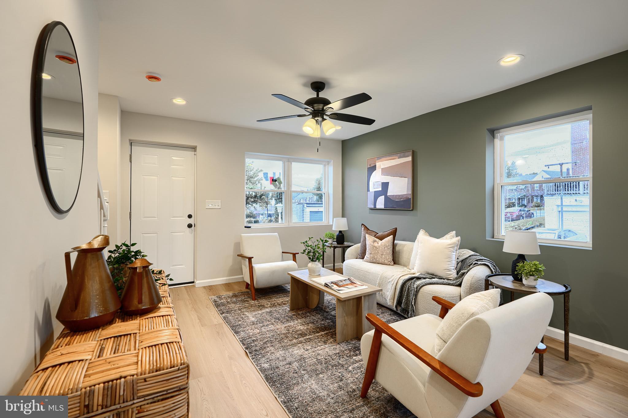 3934 Rokeby Road Baltimore, MD 21229 - Photo 7 of 38 a living room with furniture and a chandelier