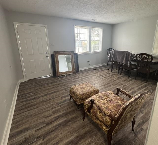 1370 East Alcy Road Memphis, TN 38106 - Photo 2 of 8 Living space featuring wood-finish flooring, light gray wall paint, and white baseboards
