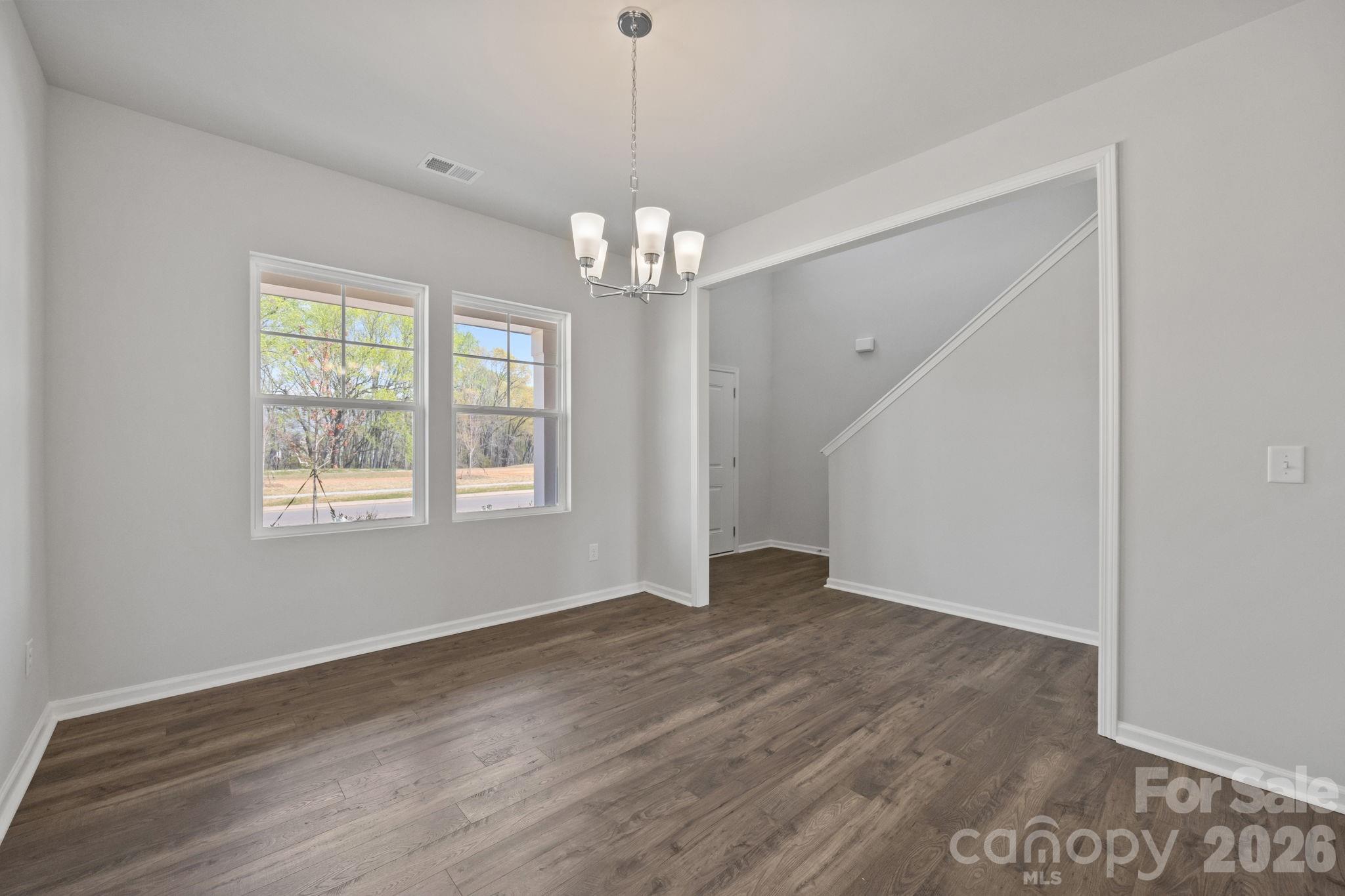 426 Brick House Road York, SC 29745 - Photo 10 of 35 a view of an empty room with wooden floor and a window