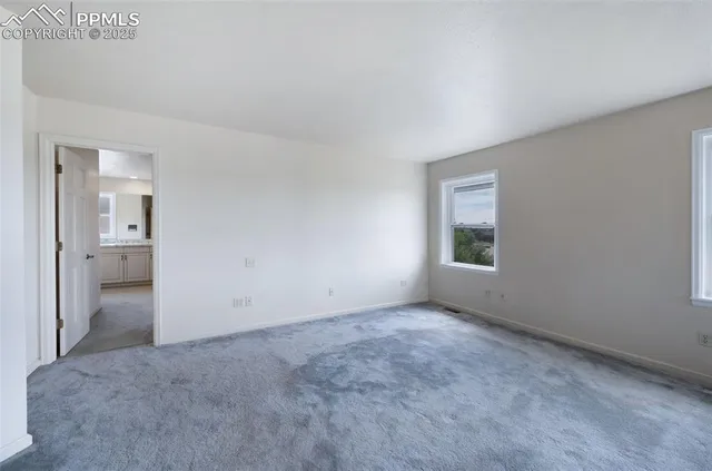 an empty room with a bathroom