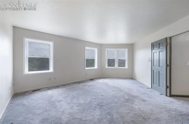 an empty room with windows