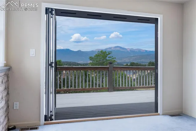 a view of a glass door with a view of balcony