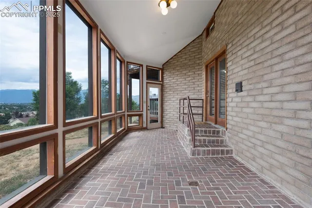 a view of empty room with windows