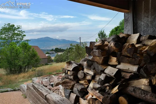 a view of a lake with lawn chairs