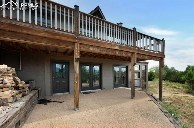 a view of a patio with table and chairs