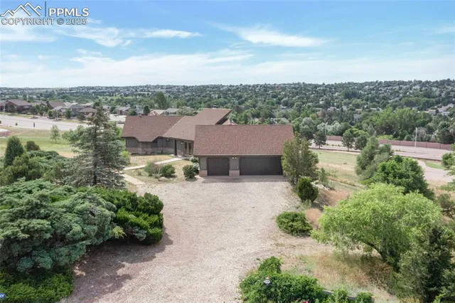 an aerial view of a house with a garden