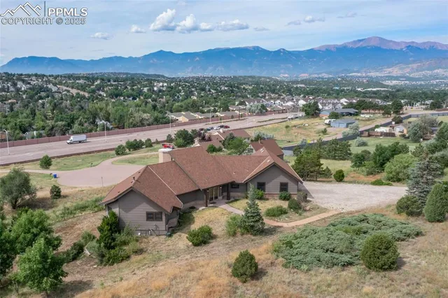 an aerial view of residential houses and outdoor space