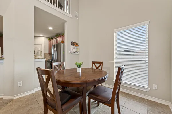 a view of a dining room with furniture and window