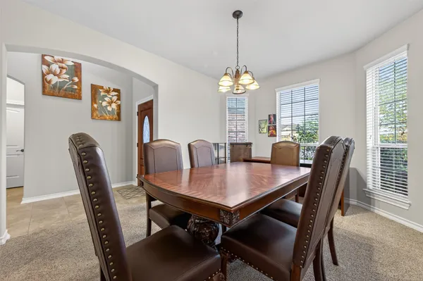 a view of a dining room with furniture