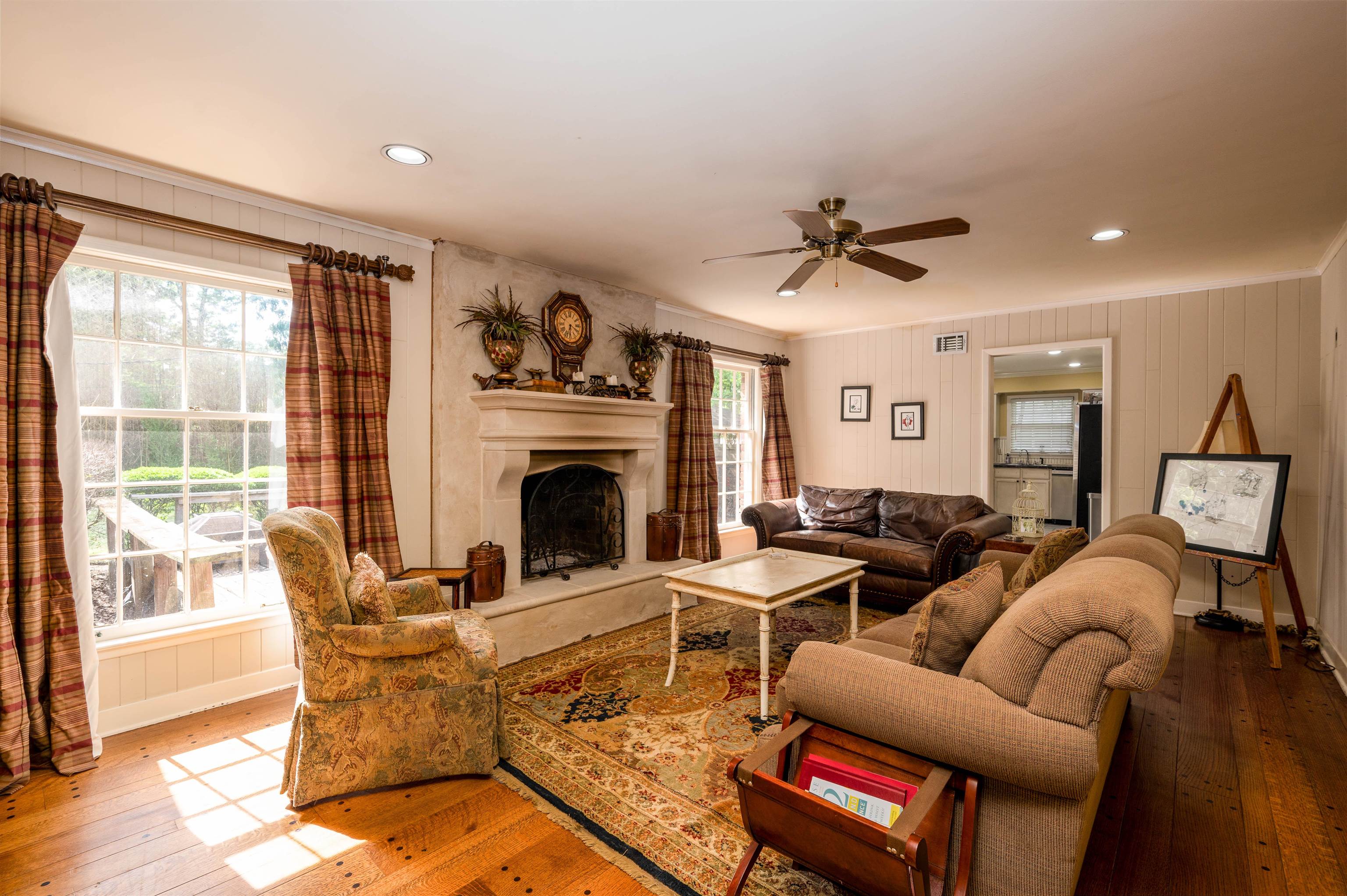 1187 Hayne Road Memphis, TN 38119 - Photo 14 of 25 a living room with furniture a fireplace and a floor to ceiling window