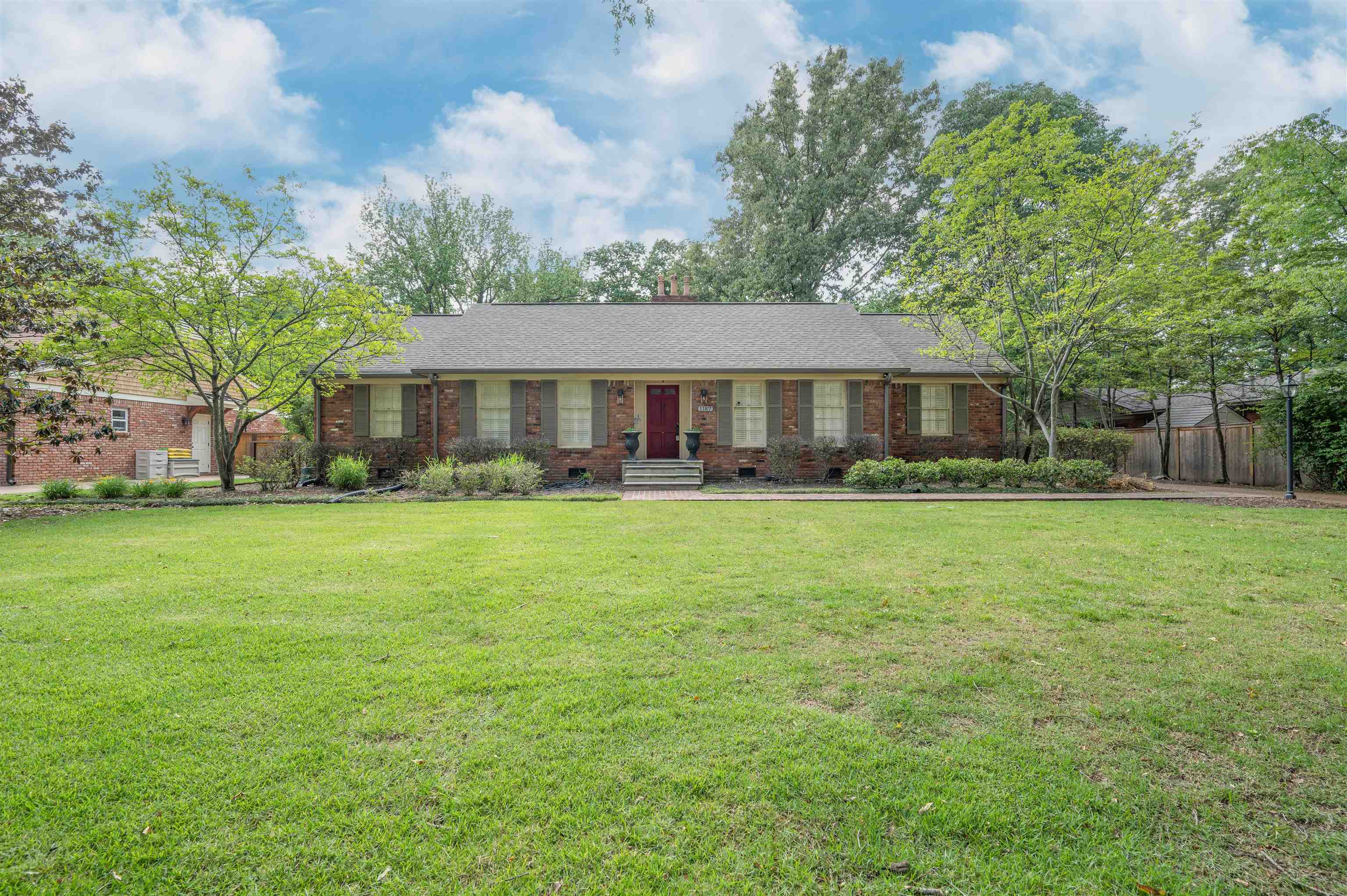 1187 Hayne Road Memphis, TN 38119 - Photo 2 of 25 a front view of house with yard and green space