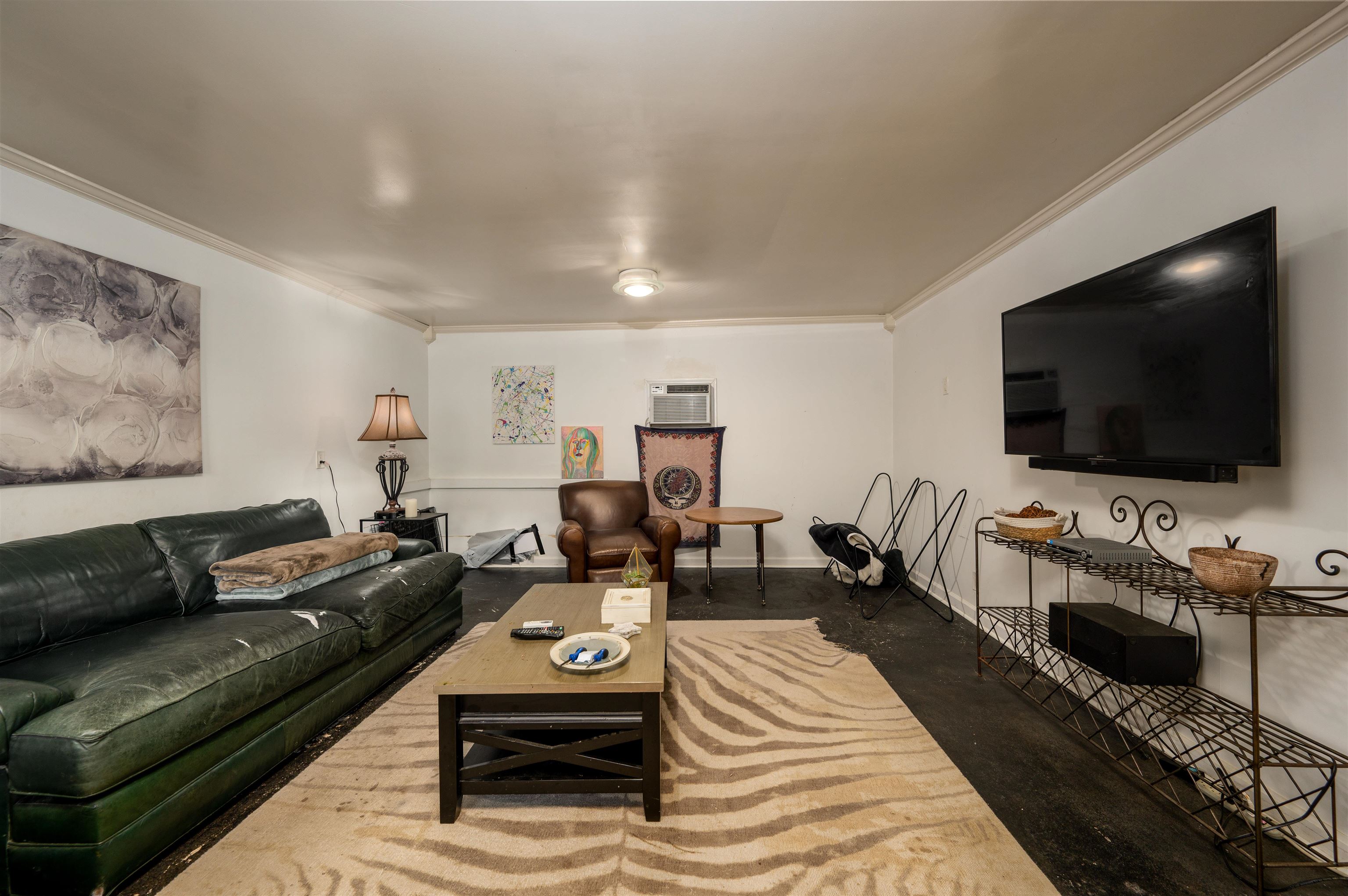 1187 Hayne Road Memphis, TN 38119 - Photo 23 of 25 a living room with furniture and a flat screen tv