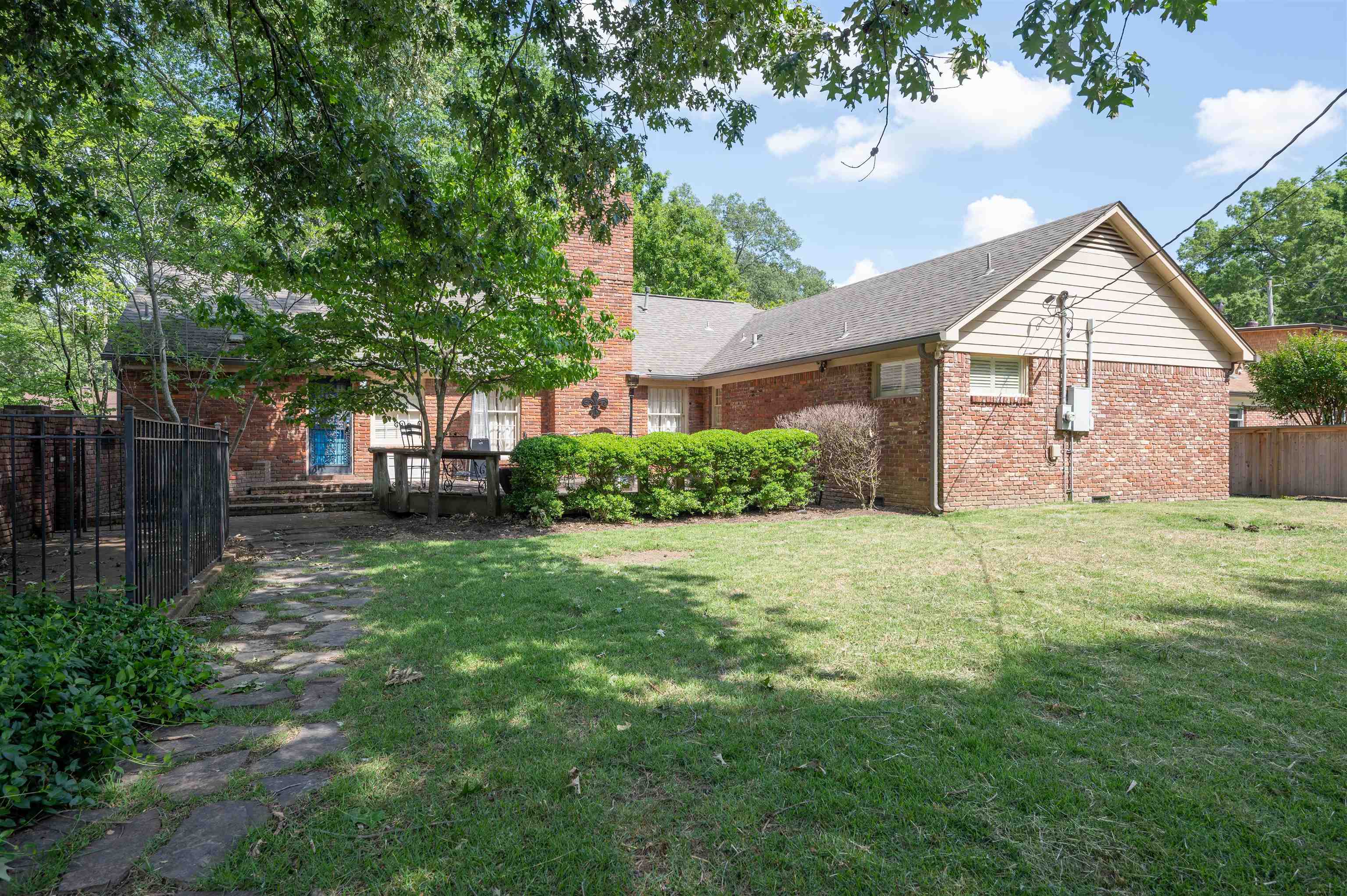 1187 Hayne Road Memphis, TN 38119 - Photo 24 of 25 a view of a yard in front of a house with large trees