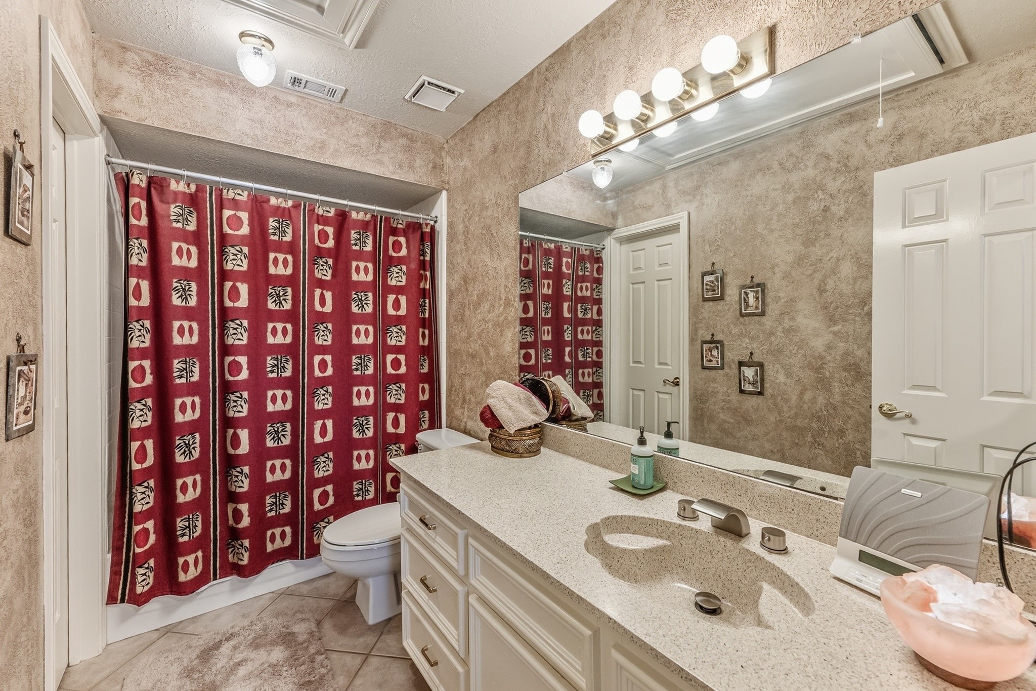 6047 Spring Creek Lane Spring, TX 77379 - Photo 26 of 50 Finished with generous counter space and new fixtures this bathroom offers comfort and convenience for family or overnight guests alike. A warm palette and classic finishes give the space a timeless, well cared for feel.