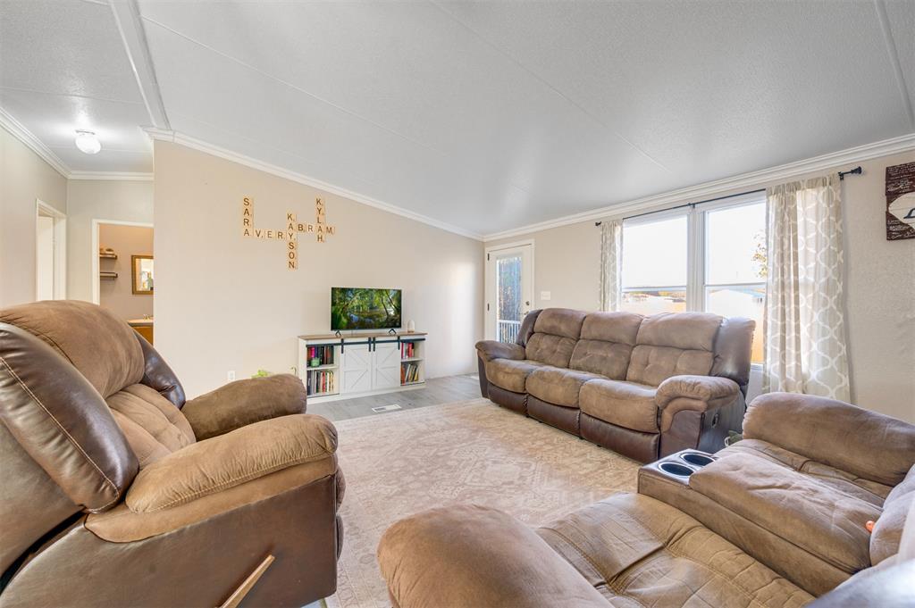 184 Private Road Sumner, TX 75486 - Photo 11 of 30 a living room with furniture and a large window