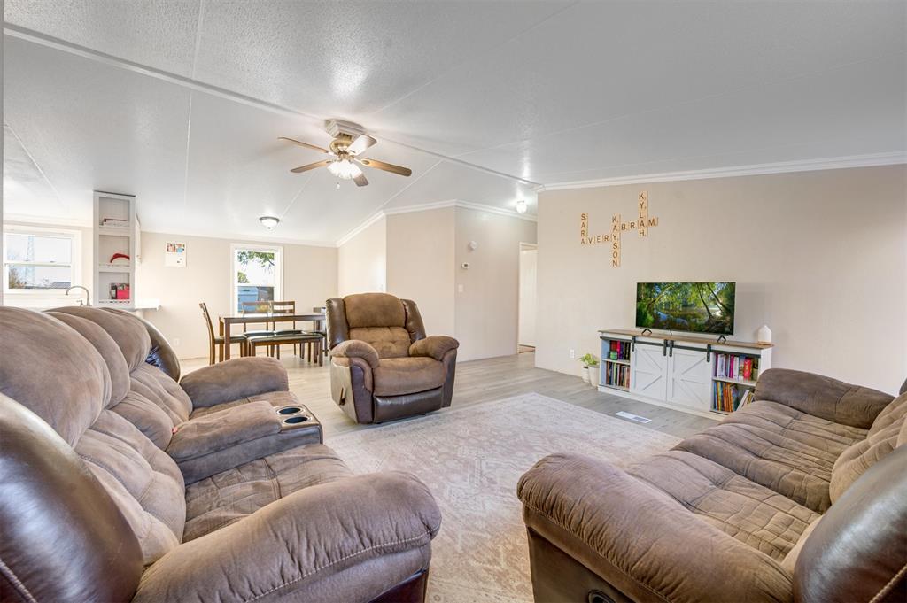 184 Private Road Sumner, TX 75486 - Photo 12 of 30 a living room with furniture and a flat screen tv