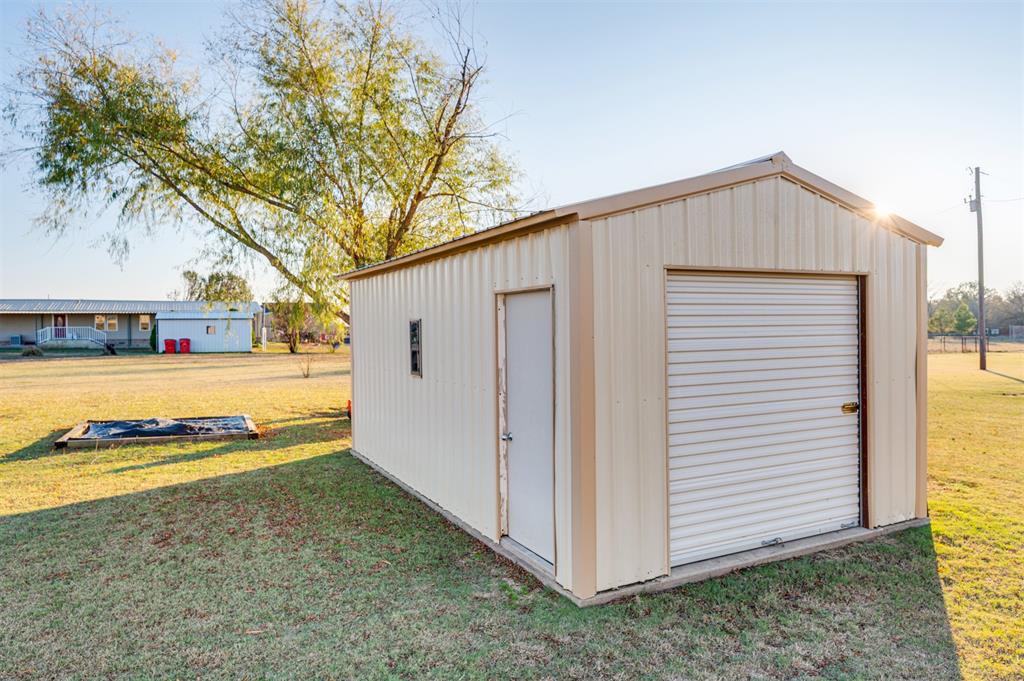 184 Private Road Sumner, TX 75486 - Photo 25 of 30 a view of a house with backyard space and tree