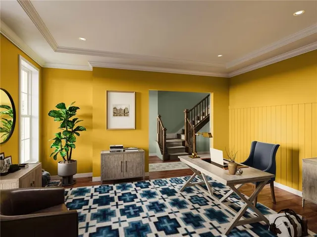 a living room with a couch and a bookshelf