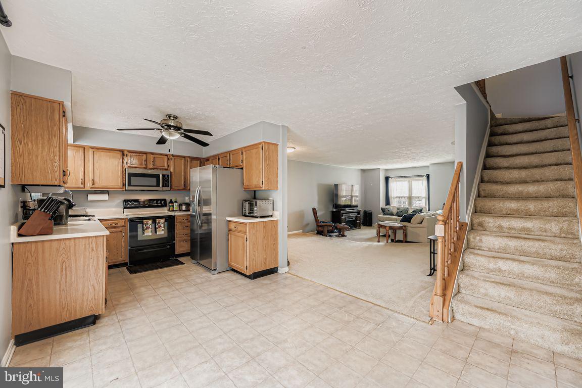 3329 Betterton Circle Abingdon, MD 21009 - Photo 14 of 38 a kitchen with refrigerator and cabinets